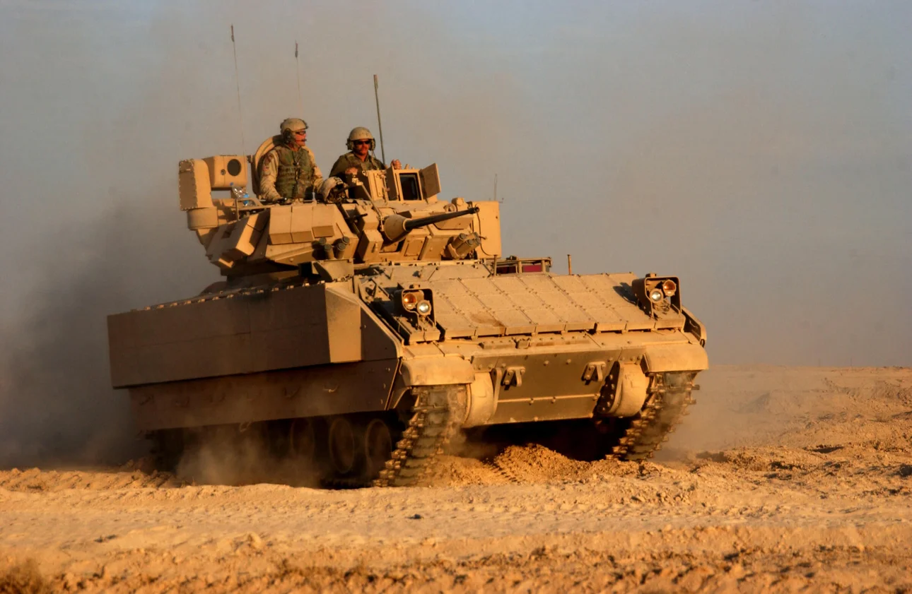 Soldiers operating an armored military vehicle equipped with high-performance slip ring technology